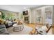 Elegant living room with hardwood floors, fireplace, and access to the patio, creating an inviting living space at 581 Garfield St, Denver, CO 80206