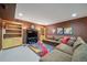 Spacious living room featuring a comfortable sectional sofa, built-in shelves, and modern artwork at 581 Garfield St, Denver, CO 80206