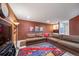Inviting living room with large sectional sofa, built-in shelving, and vibrant artwork on the walls at 581 Garfield St, Denver, CO 80206