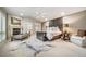 Spacious main bedroom boasts a fireplace, stylish seating, and plush textiles for ultimate relaxation at 581 Garfield St, Denver, CO 80206
