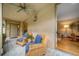 Cozy covered patio with inviting wicker seating and views into the bright living room, perfect for relaxing at 581 Garfield St, Denver, CO 80206