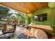 Inviting patio with a swing bed, outdoor seating, and lush greenery, perfect for relaxation and entertaining at 581 Garfield St, Denver, CO 80206