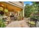 Relaxing backyard patio featuring comfortable outdoor furniture and a view of lush greenery and an adjacent patio at 581 Garfield St, Denver, CO 80206