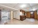 Basement featuring a small kitchenette, unfinished flooring, and an open floor plan at 4855 S Joplin St, Aurora, CO 80015