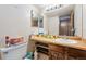 A bathroom showcases a vanity sink and toilet at 4855 S Joplin St, Aurora, CO 80015