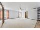 A bedroom features white walls, carpeted flooring, and a ceiling fan at 4855 S Joplin St, Aurora, CO 80015