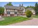 Stunning exterior showcasing Tudor style, large yard, and brick accents at 4855 S Joplin St, Aurora, CO 80015