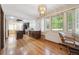 A kitchen features wood cabinets, hardwood floors, and an island at 4855 S Joplin St, Aurora, CO 80015
