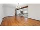 Large living room boasting wood floors, natural light, and decorative wood beam architecture at 4855 S Joplin St, Aurora, CO 80015