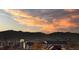 Stunning aerial view with mountain and city views at sunset at 1301 Speer Blvd # 410, Denver, CO 80204