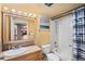 Clean bathroom with a tub shower, vanity, and toilet at 1301 Speer Blvd # 410, Denver, CO 80204