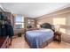 Spacious bedroom with a comfortable bed and city views at 1301 Speer Blvd # 410, Denver, CO 80204