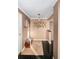 Inviting entryway with a bench and stylish wall art at 1301 Speer Blvd # 410, Denver, CO 80204