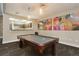 Game room with a pool table and modern artwork at 1301 Speer Blvd # 410, Denver, CO 80204
