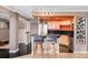 Updated kitchen featuring a breakfast bar and stylish cabinetry at 1301 Speer Blvd # 410, Denver, CO 80204