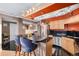 Eat-in kitchen with granite countertops and rich wood cabinets at 1301 Speer Blvd # 410, Denver, CO 80204
