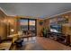 Inviting living room with comfortable chairs and a stunning sunset view from the balcony at 1301 Speer Blvd # 410, Denver, CO 80204