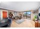 Open living room with access to kitchen and amazing city views at 1301 Speer Blvd # 410, Denver, CO 80204