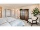 Well-lit bedroom featuring a large closet and comfortable seating area at 12354 E 101St Dr, Commerce City, CO 80022