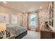 Unique bedroom featuring playful wallpaper and neutral tones at 12354 E 101St Dr, Commerce City, CO 80022