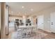 Elegant dining area next to the kitchen featuring a large table and stylish decor at 12354 E 101St Dr, Commerce City, CO 80022