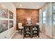 Cozy home office featuring a statement wall, a desk with storage, and natural light at 12354 E 101St Dr, Commerce City, CO 80022