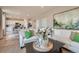 Bright living room with neutral tones, showcasing an open layout and modern furnishings at 12354 E 101St Dr, Commerce City, CO 80022