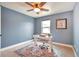 Stylish home office showcasing a modern desk, chair, and complementary decor at 15592 W Wesley Ave, Lakewood, CO 80228