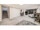 Spacious finished basement features neutral carpet and an accent wall with a decorative fireplace and comfortable seating at 6267 S Albion Ct, Centennial, CO 80121