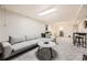 Finished basement features a neutral color palette, plush carpeting, and comfortable seating for relaxing and entertaining guests at 6267 S Albion Ct, Centennial, CO 80121