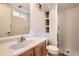 Basement bathroom featuring a neutral vanity, toilet, and shower, offering functionality and convenience at 6267 S Albion Ct, Centennial, CO 80121