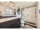 Stylish bathroom featuring a modern vanity, sleek fixtures, and a glass-enclosed shower for a spa-like experience at 6267 S Albion Ct, Centennial, CO 80121
