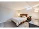 Basement bedroom with cozy furnishings, including a comfortable bed and side table at 6267 S Albion Ct, Centennial, CO 80121