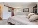 Cozy bedroom features ample natural light, neutral walls, and a warm, inviting atmosphere at 6267 S Albion Ct, Centennial, CO 80121