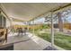 Enjoy outdoor dining on this covered patio complete with a table, chairs, and a view of the fenced backyard at 6267 S Albion Ct, Centennial, CO 80121