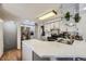 Modern kitchen featuring quartz countertops, stainless steel appliances, and bright white cabinetry at 6267 S Albion Ct, Centennial, CO 80121
