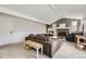Spacious living room featuring a brick fireplace, plush sofa, and bright natural light at 6267 S Albion Ct, Centennial, CO 80121
