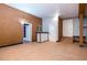 Partially finished basement with bar and storage at 4865 Scranton Ct, Denver, CO 80239