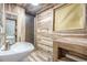 Basement bathroom with wood-look tile and shower at 4865 Scranton Ct, Denver, CO 80239