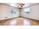 Spacious bedroom with hardwood floors and built-in shelves at 4865 Scranton Ct, Denver, CO 80239