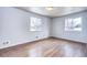 Bright bedroom with hardwood floors and large windows at 4865 Scranton Ct, Denver, CO 80239