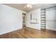 Well-lit bedroom with hardwood floors and a large closet at 4865 Scranton Ct, Denver, CO 80239