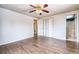 Bedroom with hardwood floors and door to bathroom at 4865 Scranton Ct, Denver, CO 80239