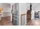 Stainless steel refrigerator in a kitchen with hardwood flooring at 2439 Purcell Pl, Brighton, CO 80601