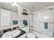 Well-maintained bathroom boasts glass-enclosed shower, modern sink, and tasteful fixtures at 32217 Buffalo Park Rd, Evergreen, CO 80439
