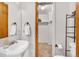 Clean bathroom featuring single vanity, toilet, and a walk in closet at 32217 Buffalo Park Rd, Evergreen, CO 80439