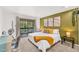 Airy bedroom with private balcony offering views, complete with modern décor and furnishings at 32217 Buffalo Park Rd, Evergreen, CO 80439