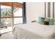 Cozy bedroom with balcony access, offering natural light and mountain views at 32217 Buffalo Park Rd, Evergreen, CO 80439