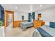 Cozy bedroom featuring two twin beds with wood accents and charming decor at 32217 Buffalo Park Rd, Evergreen, CO 80439