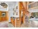 Inviting foyer features wood accents, slate floors, and direct access to the adjacent living room at 32217 Buffalo Park Rd, Evergreen, CO 80439